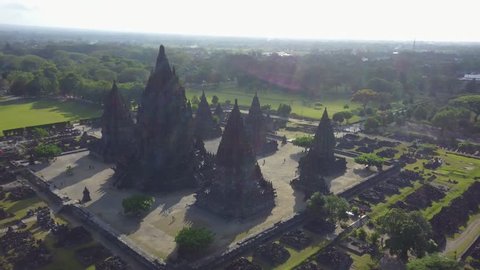 Beautiful aerial landscape footage of Prambanan temple complex from a drone flying spinning around the temple in Yogyakarta, Indonesia. Shot in 4k resolution