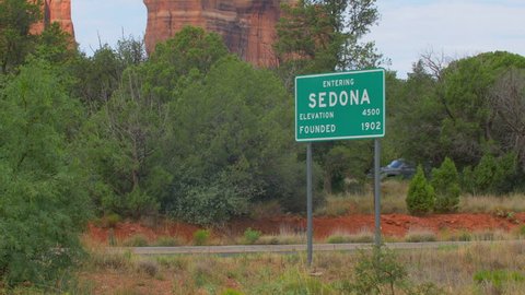 Sedona town sign zoom out to Establishing Shot of Cathedral Rock.