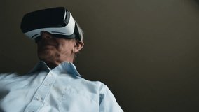 Elderly Man Using Virtual Reality Headset