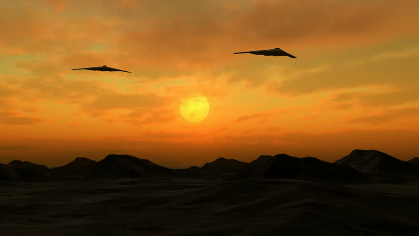 Two B-2 stealth bombers flying overhead at Dawn.