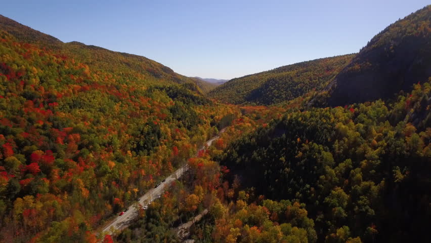 Aerial shot moving through Adirondacks next to Giant mountain.