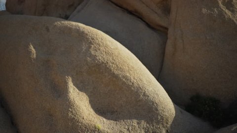 A close-up of few large boulders in the desert for green screen or chroma key. Out of focus or defocused shot for compositing or keying.