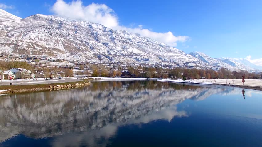 Pond With Snowy Mountain Reflection Aerial