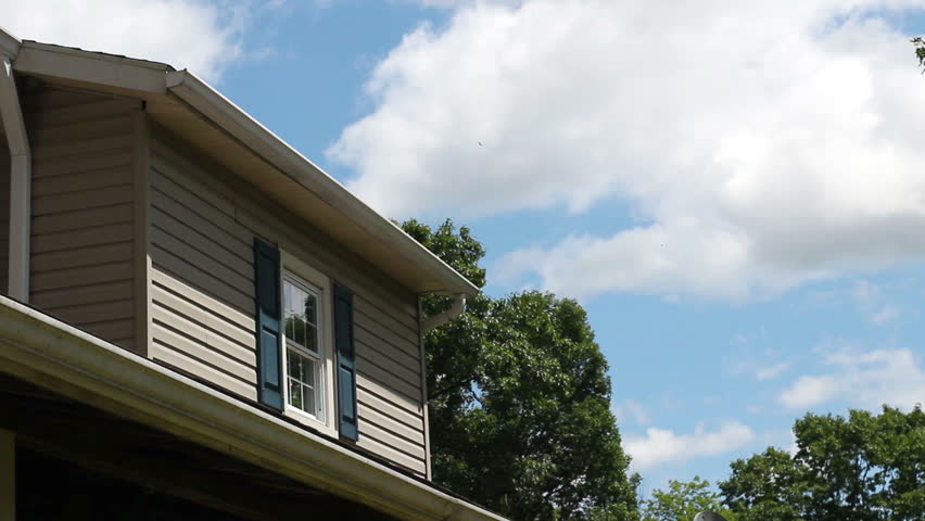 Cloudy Afternoon Timelapse over a small suburban window in america