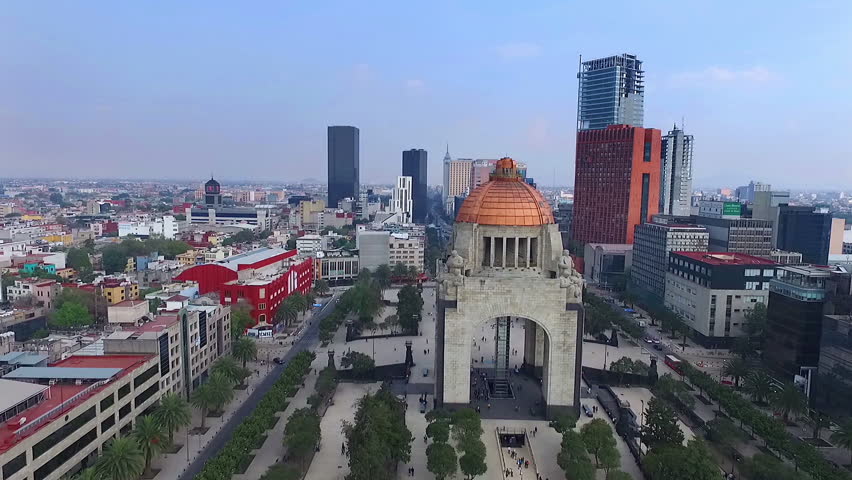 Stunning aerial shot of the Mexican Revolution monument in Mexico City. Some buildings at background. This tourist atraction is one of the most famous and representative mexican historic monuments. Royalty-Free Stock Footage #29566132