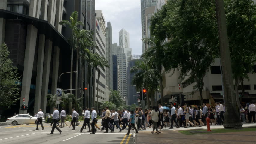 Crowd of business people crossing the street in downtown Singapore, Asia Royalty-Free Stock Footage #29576395