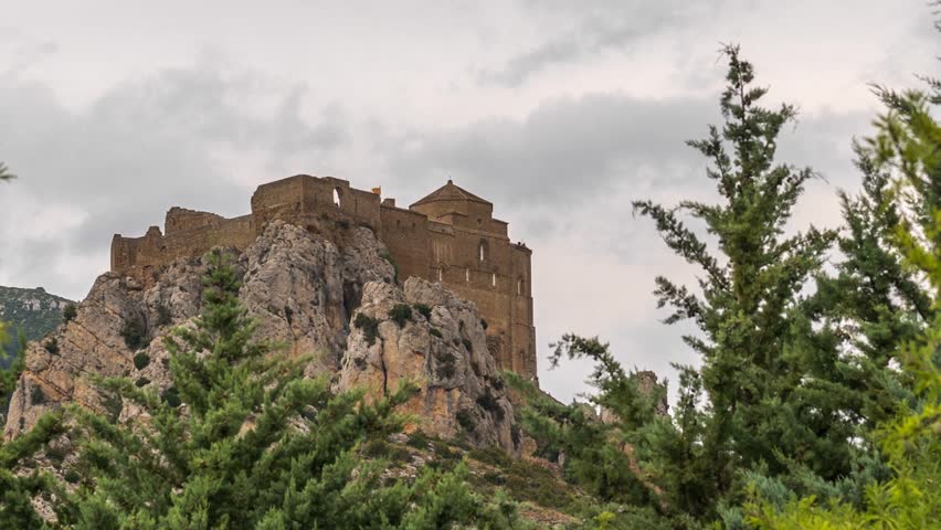 Castle of Loarre and surroundings, Hoya de Huesca Loarre Aragon Huesca Spain, castillo de loarre. Time lapse, View from below, with storm clouds