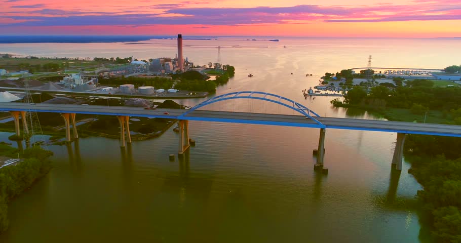 Stunning twilight aerial view of Leo Frigo Memorial Bridge spanning Fox River.
