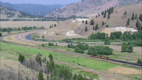 Freight Train Approaching Bend In Clark Fork River