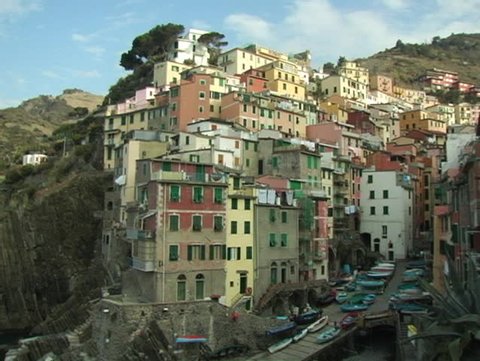 Beautiful Italian Riviera town of Riomaggiore.  Pan to ocean.