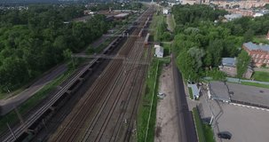 4K aerial view drone video of Orekhovo-Zuevo railway tracks, abandoned dilapidated old factory buildings, area near main railway station in small town 100 km east of Moscow, Russia on summer morning