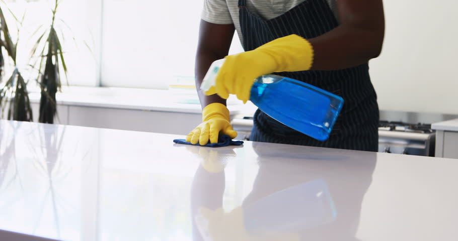 Man cleaning the kitchen worktop at home | Shutterstock HD Video #29611354