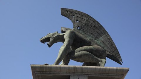 valencia spain 07-19- 2017   A mythical gryphon statue  from  Valencia city in   Spain - Four statues guard a bridge in the middle of valencia city