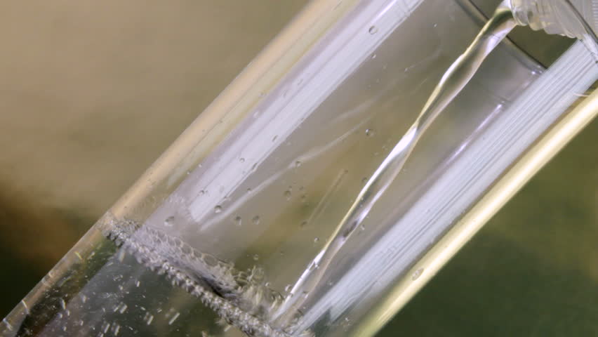Closeup of Raki being poured into angled glass