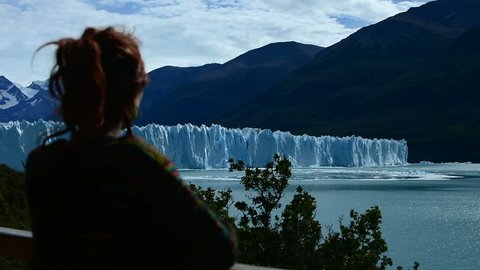 A woman looks the Perito Moreno Glacier