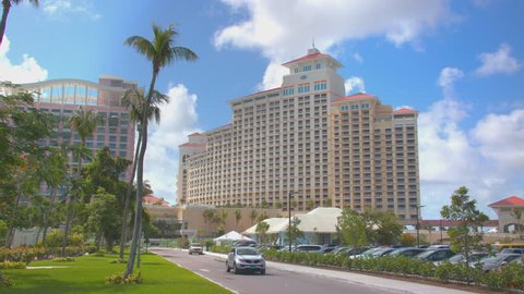 NASSAU, BAHAMAS - 2017: Baha Mar Resort and Casino Exterior with Passing Car Driving on Hotel Property Grounds