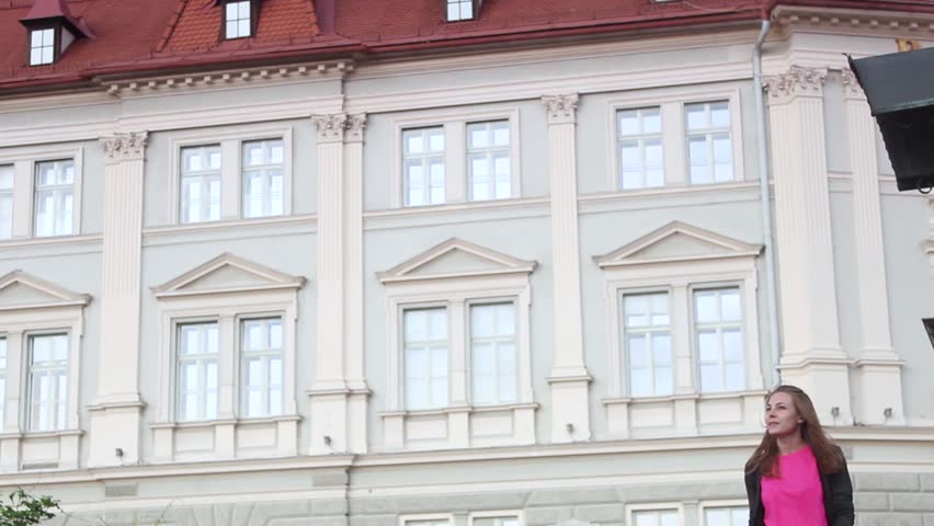 a Tourist Girl Walks Around the City of Wolfsberg in Austria.