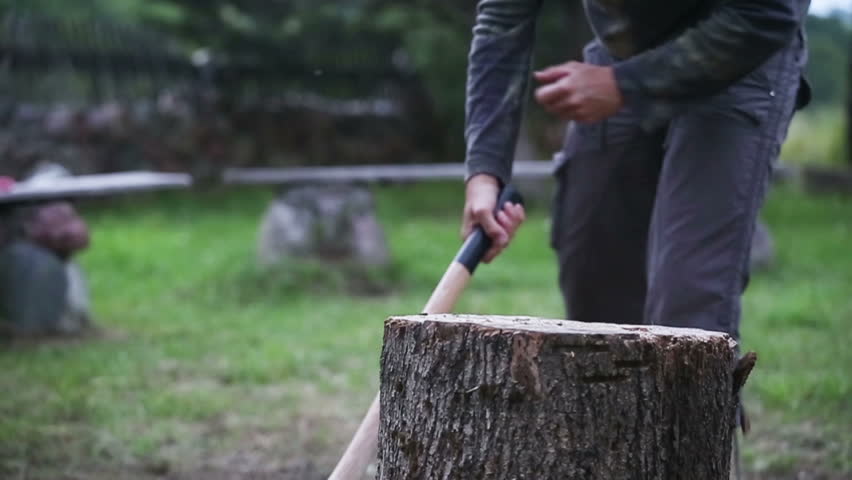 Man chopping wood, slow motion