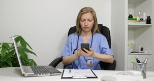 Medical Doctor Woman Taking Recipe Notes Surfing Internet On Mobile Phone In Hospital