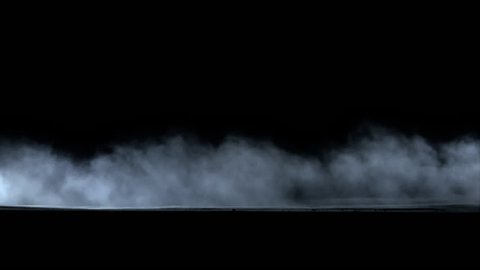 Side view of dust trail behind car isolated on black background, with alpha matte.