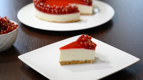 Eating cheesecake with red currants