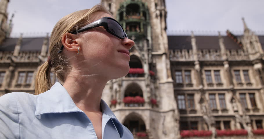 Elegant Blonde Woman Wait Partner In Meeting Point, Munich City Hall Tower Icon