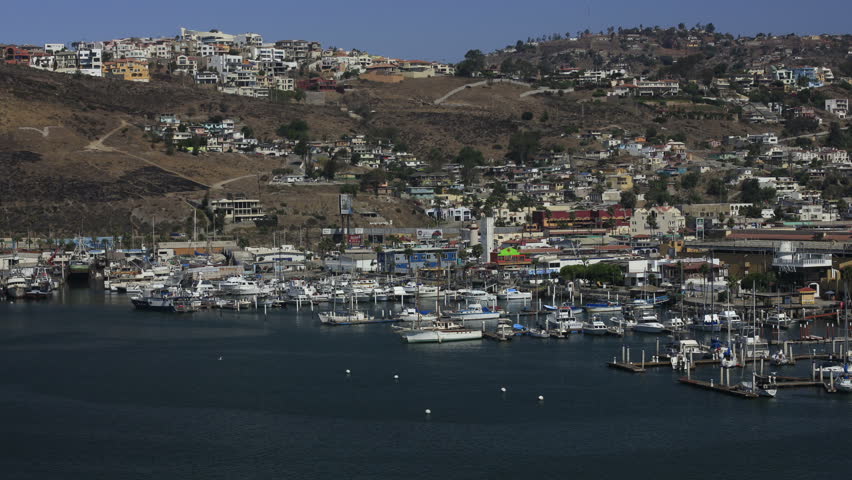This is a time lapse shot of the harbor in Ensanada, Mexico on a sunny day as