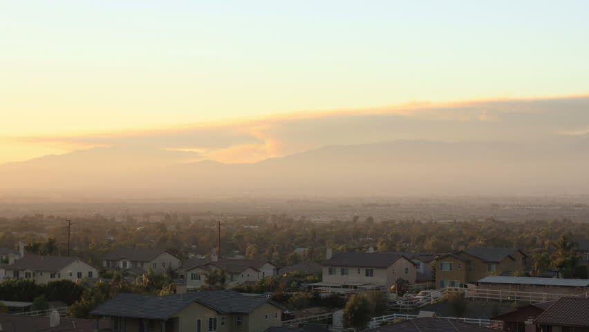 This is a wide shot time lapse at dusk of a forest fire in the Angeles National