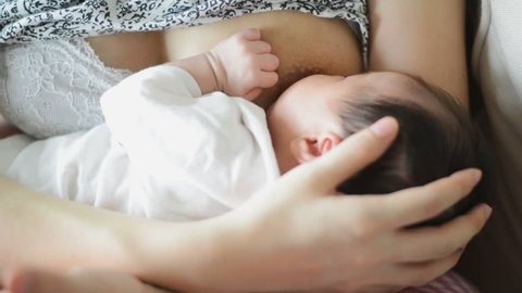 Mother breastfeeding her baby.