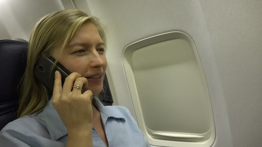 Smiling Business Woman Talking At Mobile Phone, Partner Connection Inside Airplane | Shutterstock HD Video #29669815