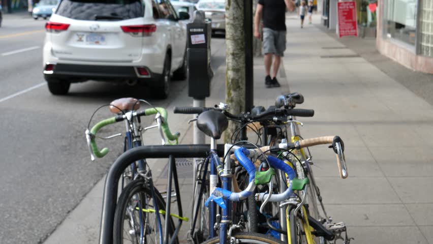 VANCOUVER,CANADA - CIRCA August 2017 :slow motion of bicycles parked and locked