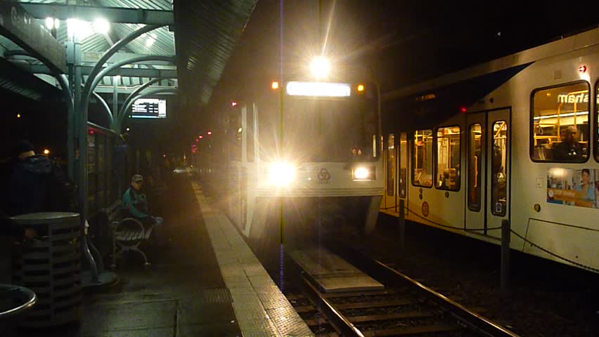 PORTLAND, OREGON - CIRCA 2012: Night exterior with MAX trains traveling on rail