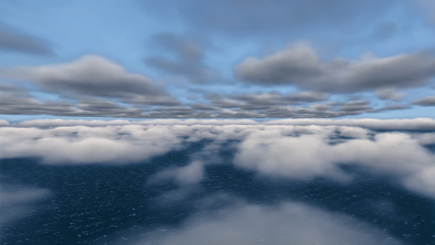 Flying over the ocean through clouds.