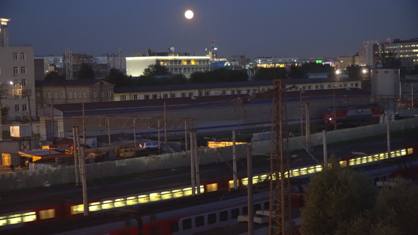  night movement of trains on a railway junction in moon light
