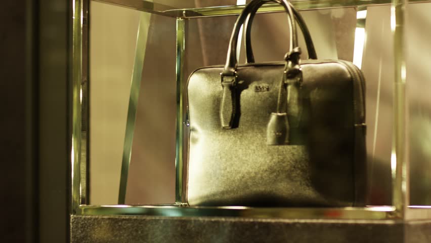 handbag on display behing glass case