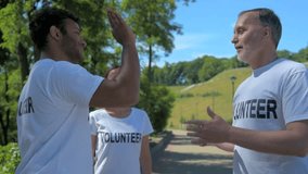 Positive volunteers giving high five