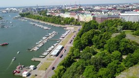 4K aerial view drone footage of Helsinki recreation area with sea bay, bungee jumping tower, boats, yachts, coastline and park near Uunisaari and Liuskaluoto in the capital of Finland, northern Europe