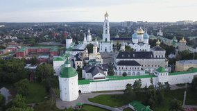 4K aerial view drone video of Sergiev Posad medieval Troice-Sergiev's Lavra complex of churches, cathedrals, walls, roads and area around in small town 70 km east of Moscow, Russia on summer morning