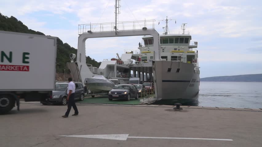 Brestova, Croatia - July 24, 2017: Ferry boat is unloaded with cars in the port of Brestova in Croatia