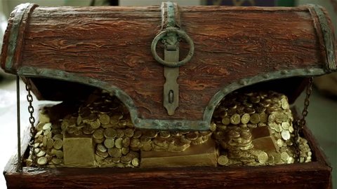 A wooden chest with gold coins.