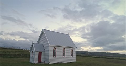 Aerial: Small historic pioneer church in Awhitu penninsula, Auckland New Zealand