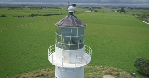 AERIAL: Cape Egmont lighthouse and farmland Mt Taranaki / Mt Egmont, New Zealand