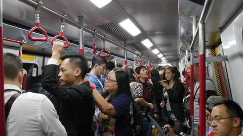 HONG KONG, CHINA - DECEMBER 2016: metro crowded wagon panorama 4k circa december 2016 hong kong, china.