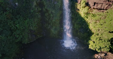 AERIAL: flying over waterfall at Dawson Falls, Mt Taranaki / Mt Egmont, New Zealand