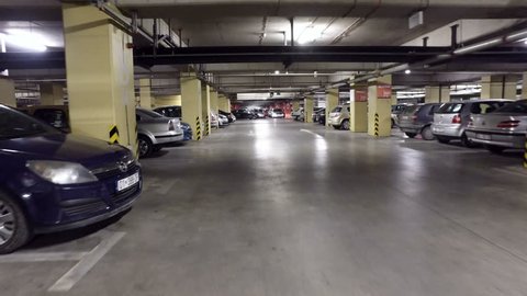 SKOPJE, MACEDONIA, circa MARCH, 2017: Pov drive through underground parking of a big mall/shopping centre garage,real time