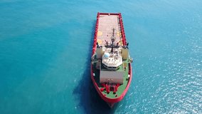 Red Offshore supply ship at sea - Aerial footage