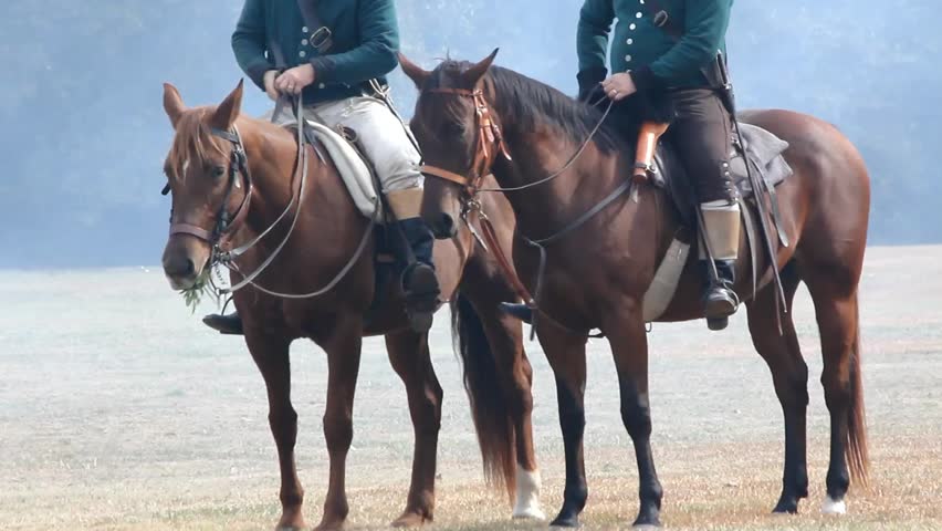 two horses partially visible riders battlefield Stok Videosu (%100 Telifsiz...