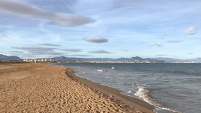 Video of a long Sand Beach with the sea surf. Alicante, Spain
