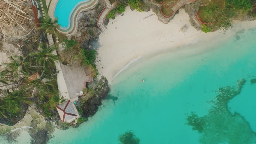 Light green sea coast with reefs. The beautiful nature of the Philippines. Aerial view.