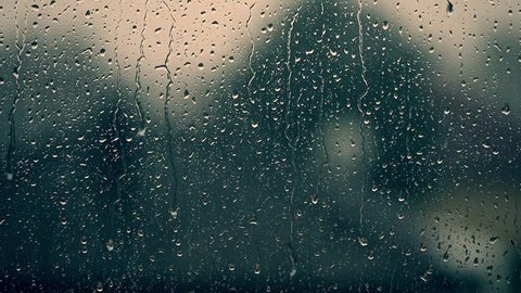 rain days, heavy rain falling on window surface 
